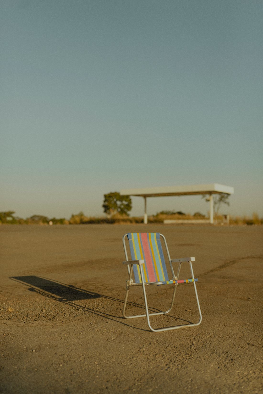 A folding chair standing in an open outdoor space.